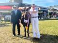 Judge Kevin Smith, Hillcrest, Borallon via Ipswich, Qld, with the junior champion Ayrshire female Mayfield Farms Tuxedo Showcase shown by Paul and Vicki Timbs, Mayfield Farms, Jaspers Brush, and led by Georgia Hearn, Nowra. 