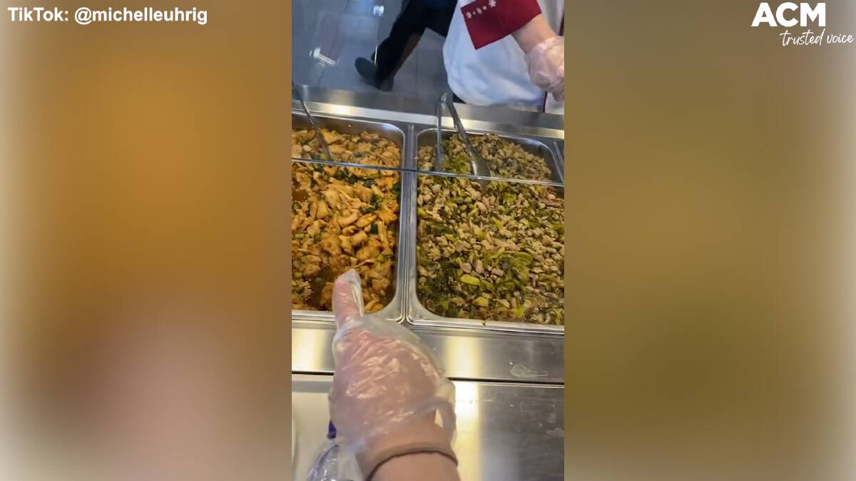 Athletes are required to wear plastic gloves as they walk around dining hall. Some of the food is self-serve while other sections have attendants.