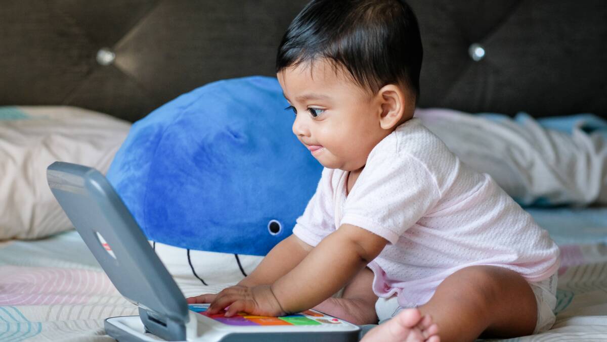 This working baby is checking if her name is on the list. Photo: Mahmud Ahsan. This working baby is checking if her name is on the list. Photo: Mahmud Ahsan.