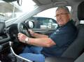 LET'S RIDE: John Santos behind the wheel of the car provided by the Cancer Council to help transport patients to their appointments.