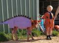 Samuel Schutz and his Jersey calf as Dino and Fred Flintstone.