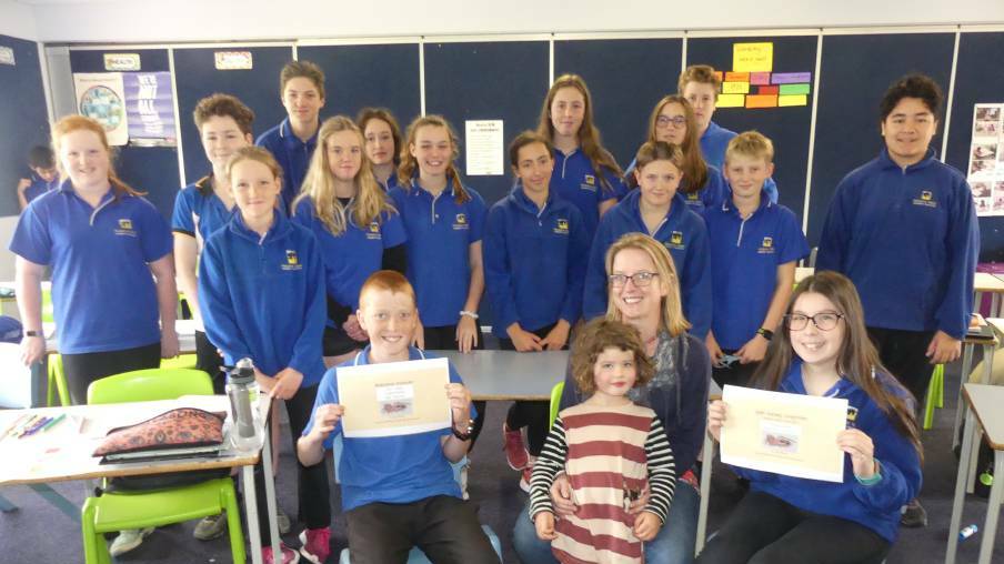 NEW SPIDER: Arachnologist Dr Jess Marsh with her daughter, winning students Samuel Coleby and Chaeli Rowley, and the rest of the KICE Year 8 science class at Kingscote. Photo: Stan Gorton NEW SPIDER: Arachnologist Dr Jess Marsh with her daughter, winning students Samuel Coleby and Chaeli Rowley, and the rest of the KICE Year 8 science class at Kingscote. Photo: Stan Gorton