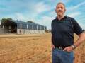 Shed advantage: The Wheelhouse Group's Wes Wheelhouse in front of his 3000 tonne fertiliser shed in Bridgewater, says the extra cost of a pre-cast wall and getting the correct pitch height are important considerations when designing a shed.