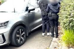 A doctor was arrested a second time as part of a probe into a hidden device in a staff toilet. Photo: HANDOUT/VICTORIA POLICE