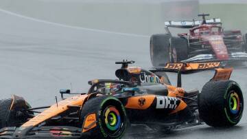 Australia's Oscar Piastri drives through the rain before the red flag came out at the Belgian GP.  Photo: EPA PHOTO