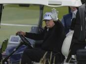 Donald Trump was spotted playing golf at one of his Scottish properties ahead of official meetings. Photo: AP PHOTO