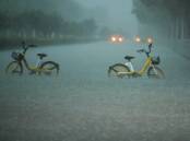Flash flooding washed away 19 houses in areas near the Chinese city of Jinan. Photo: AP PHOTO