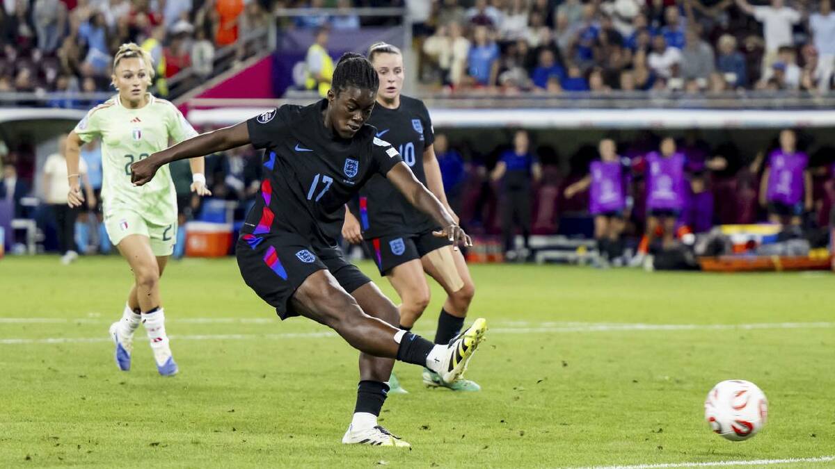 Teenage substitute Michelle Agyemang scores a late England equaliser against Italy in Geneva. (AP PHOTO)