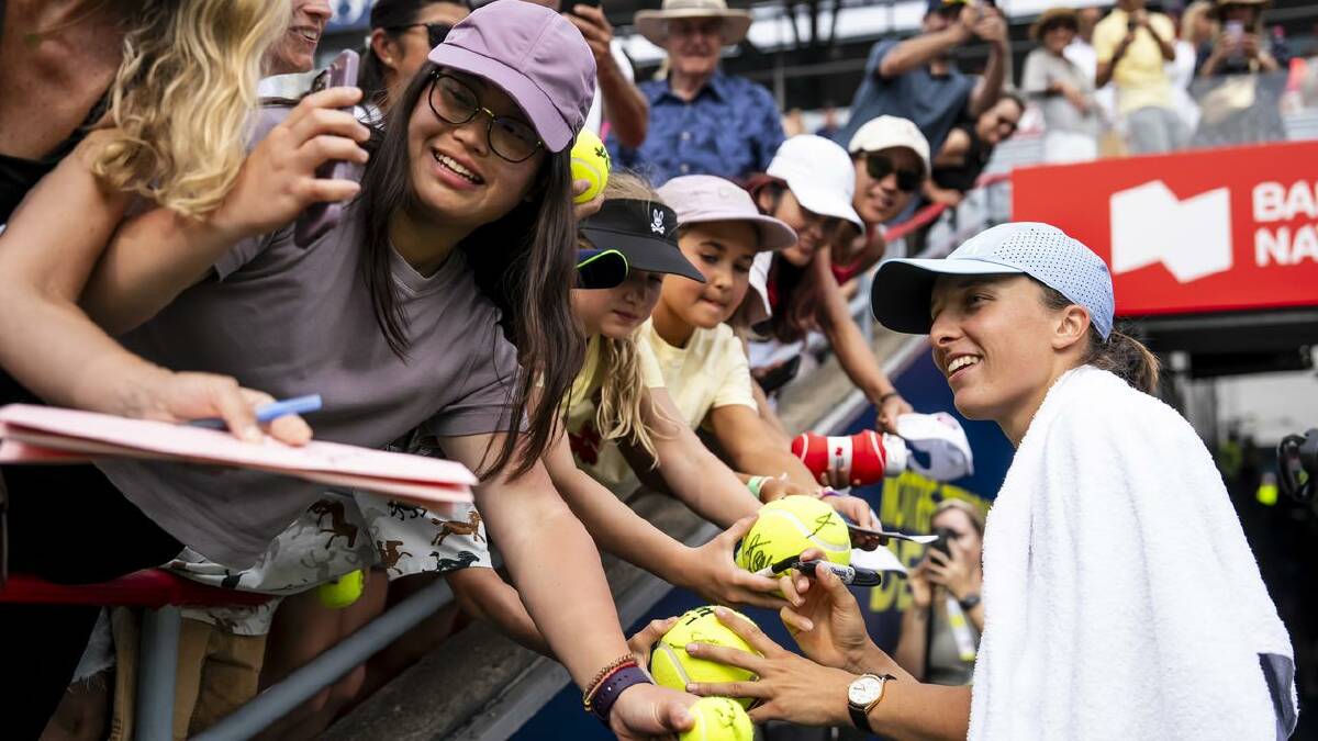 Iga Swiatek chats with fans after her straight-sets win. (AP PHOTO) Iga Swiatek chats with fans after her straight-sets win. (AP PHOTO)