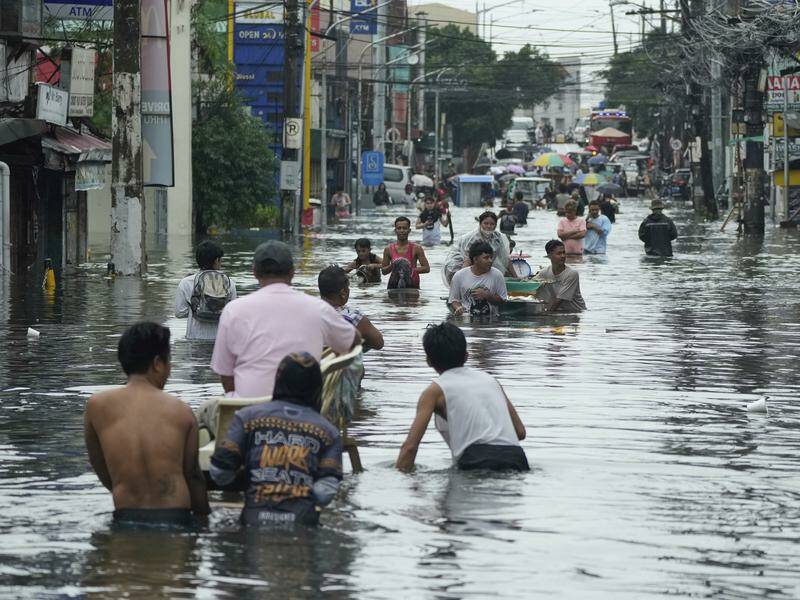 Philippines officials have reported at least 25 weather-related deaths, mostly due to flash floods. Photo: AP PHOTO Philippines officials have reported at least 25 weather-related deaths, mostly due to flash floods. Photo: AP PHOTO