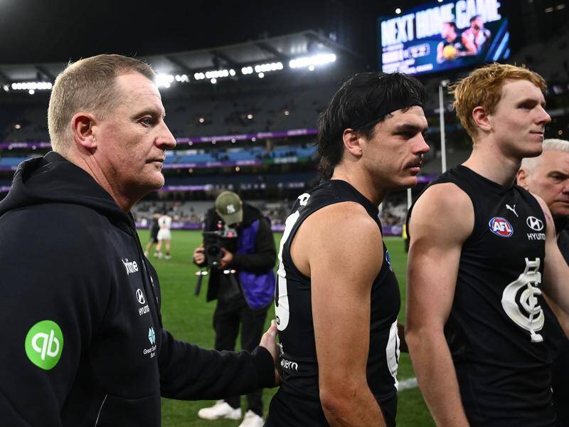 Carlton have been fined by the AFL over their handling of Elijah Hollands (c) on April 16. Photo: Joel Carrett/AAP PHOTOS