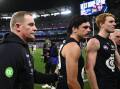 Carlton have been fined by the AFL over their handling of Elijah Hollands (c) on April 16. Photo: Joel Carrett/AAP PHOTOS