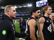 Carlton have been fined by the AFL over their handling of Elijah Hollands (c) on April 16. Photo: Joel Carrett/AAP PHOTOS