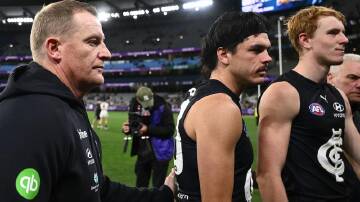 Carlton have been fined by the AFL over their handling of Elijah Hollands (c) on April 16. Photo: Joel Carrett/AAP PHOTOS