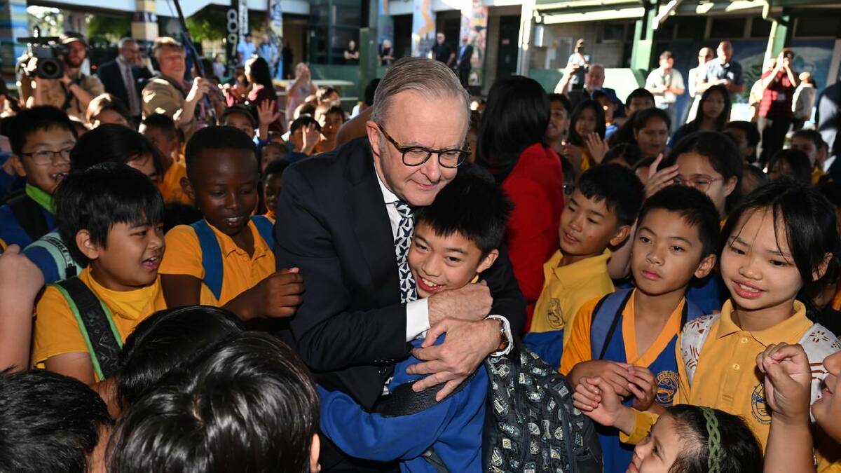 One happy kid even got a hug from Anthony Albanese during the visit. (Lukas Coch/AAP PHOTOS) One happy kid even got a hug from Anthony Albanese during the visit. (Lukas Coch/AAP PHOTOS)
