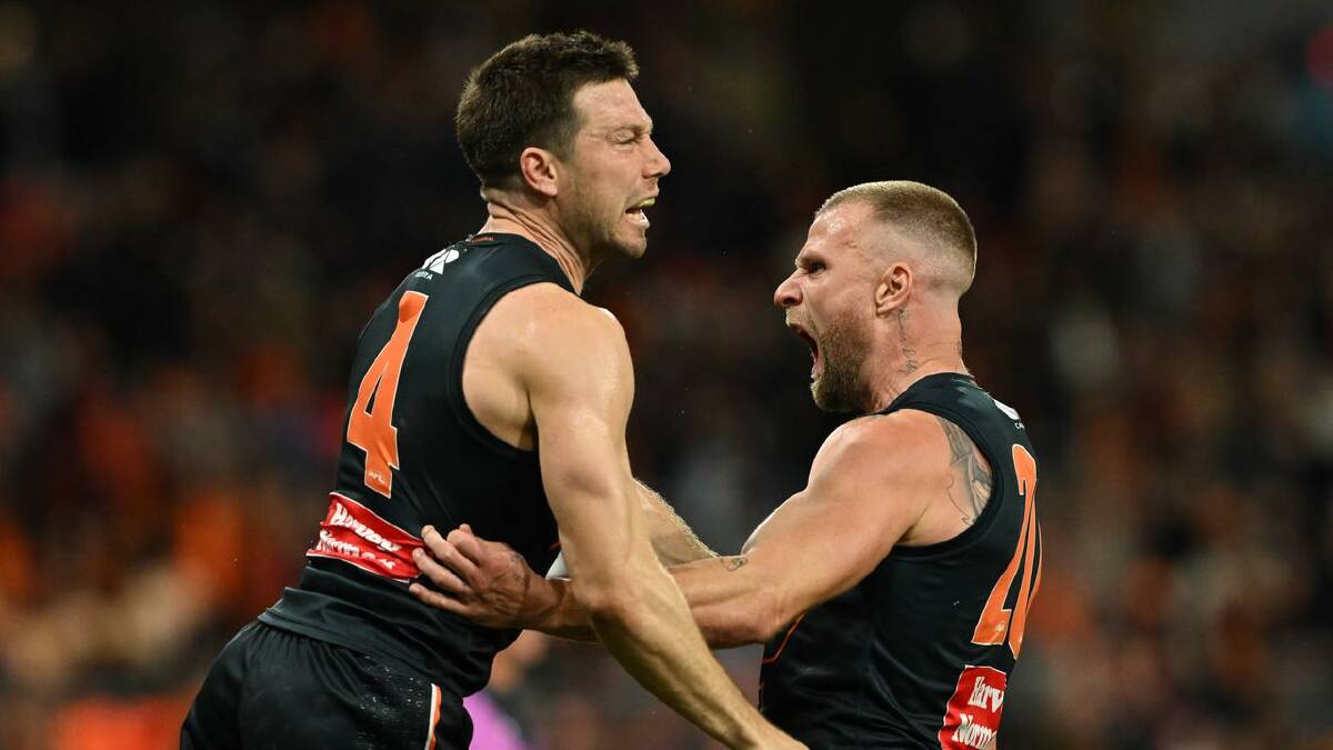 Toby Greene and Jake Stringer explode with emotion during a thrilling second half by the Giants. (Dean Lewins/AAP PHOTOS)