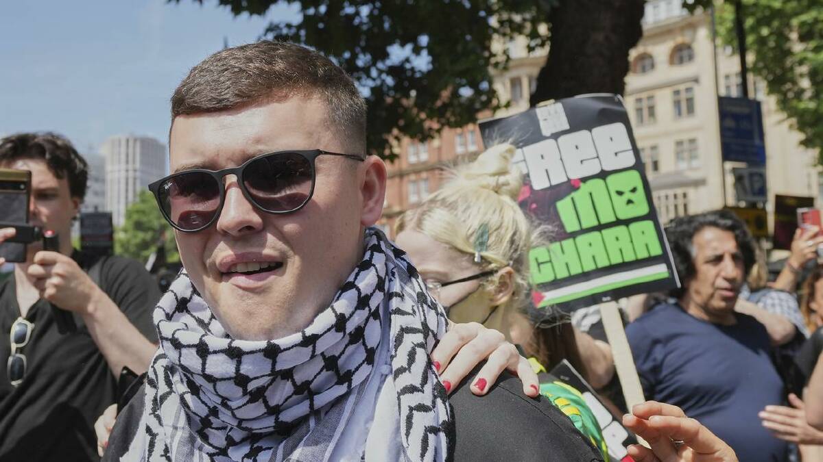 Liam Og O hAnnaidh was charged with after allegedly waving a Hezbollah flag at a gig. (AP PHOTO)