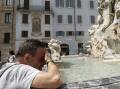 A man refreshes himself at a fountain in Rome amid a heatwave across southern Europe. Photo: AP PHOTO