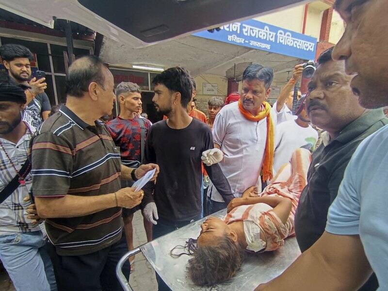 A high-voltage electric wire reportedly fell on a temple path in India, triggering a stampede. Photo: AP PHOTO A high-voltage electric wire reportedly fell on a temple path in India, triggering a stampede. Photo: AP PHOTO