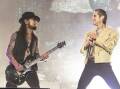 Dave Navarro and Perry Farrell are duking it out in court amid claims of assault onstage. Photo: AP PHOTO