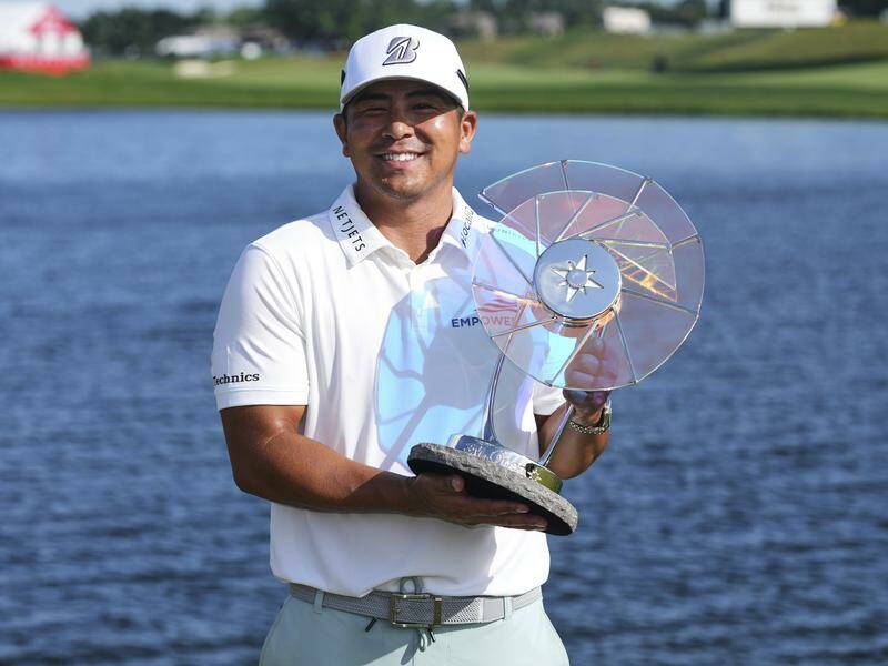 Kurt Kitayama celebrates with the trophy after winning the 3M Open in Minnesota. Photo: AP PHOTO