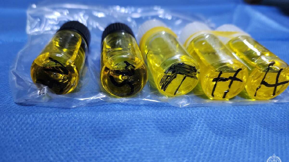 Police found vials that were marketed as "supercharged" and intended for use in vapes. (HANDOUT/NSW POLICE)