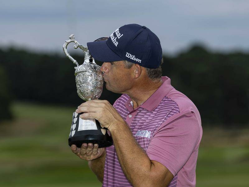 Padraig Harrington celebrates with the trophy after winning the Senior British Open at Sunningdale. Photo: AP PHOTO Padraig Harrington celebrates with the trophy after winning the Senior British Open at Sunningdale. Photo: AP PHOTO