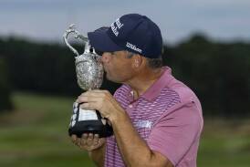 Padraig Harrington celebrates with the trophy after winning the Senior British Open at Sunningdale. Photo: AP PHOTO