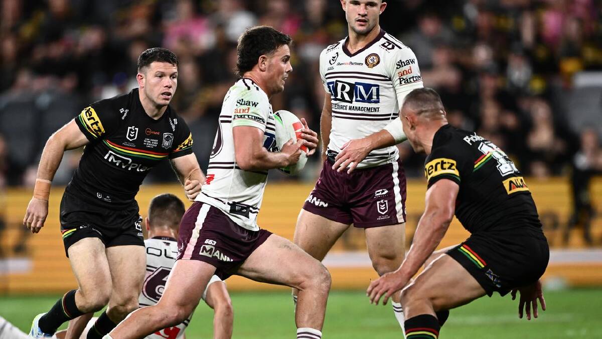 Joey Walsh spots a gap and runs against the Panthers. (Dan Himbrechts/AAP PHOTOS)