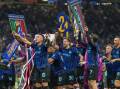 Inter players celebrate the club's 21st Italian title triumph in Milan after the win over Parma. Photo: AP PHOTO