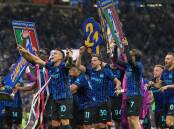 Inter players celebrate the club's 21st Italian title triumph in Milan after the win over Parma. Photo: AP PHOTO