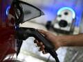 NSW plans to add more than 500 EV-charging facilities in 130 suburbs over the next 12 months. Photo: James Ross/AAP PHOTOS