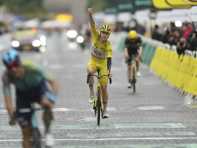 Tadej Pogacar savours the moment of victory as he crosses the finish line of the final stage. Photo: AP PHOTO Tadej Pogacar savours the moment of victory as he crosses the finish line of the final stage. Photo: AP PHOTO