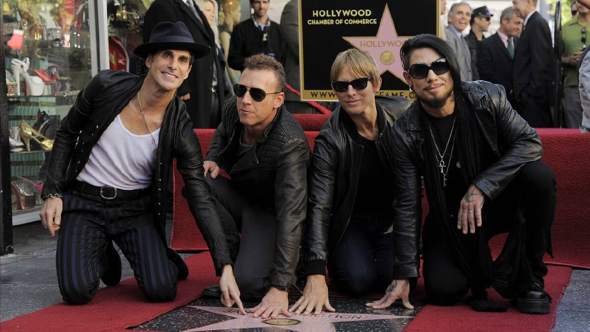 Members of Jane's Addiction pose with their star on the Hollywood Walk of Fame in 2013. (AP PHOTO)