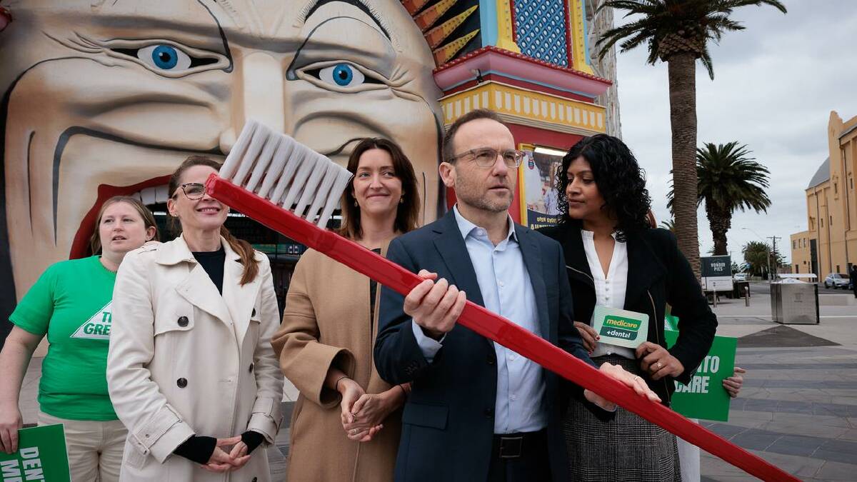 Greens leader Adam Bandt wielded a huge toothbrush to illustrate his party's dental Medicare policy. (Nadir Kinani/AAP PHOTOS) Greens leader Adam Bandt wielded a huge toothbrush to illustrate his party's dental Medicare policy. (Nadir Kinani/AAP PHOTOS)