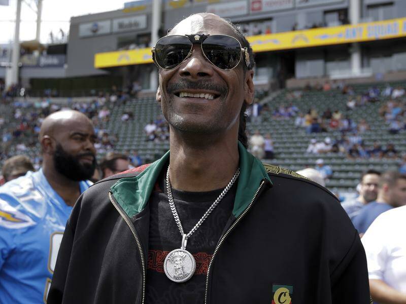 Football fan Snoop Dogg is "proud to be part of Swansea City". Photo: AP PHOTO