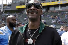 Football fan Snoop Dogg is "proud to be part of Swansea City". Photo: AP PHOTO