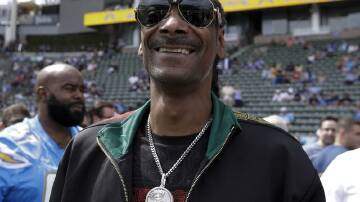Football fan Snoop Dogg is "proud to be part of Swansea City". Photo: AP PHOTO