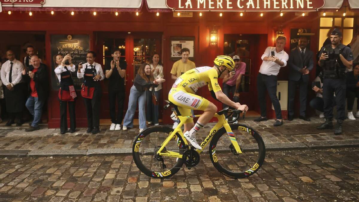 Slovenia's Tadej Pogacar pedals through the Montmartre district of Paris during the final stage. (AP PHOTO) Slovenia's Tadej Pogacar pedals through the Montmartre district of Paris during the final stage. (AP PHOTO)