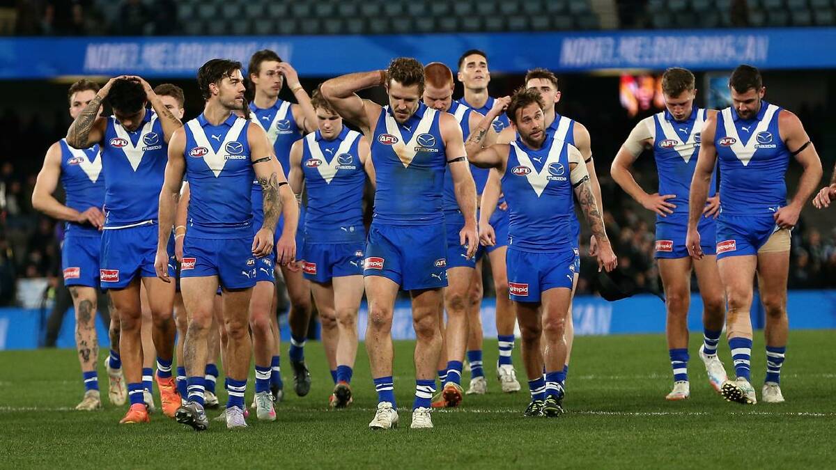 North Melbourne players were left scratching their heads after the belting from Geelong. (Rob Prezioso/AAP PHOTOS)