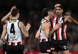 St Kilda teammates congratulate Nasiah Wanganeen-Milera (right) for scoring against the Demons. Photo: Joel Carrett/AAP PHOTOS