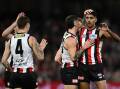 St Kilda teammates congratulate Nasiah Wanganeen-Milera (right) for scoring against the Demons. Photo: Joel Carrett/AAP PHOTOS