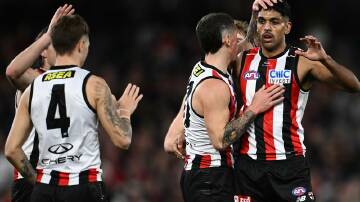 St Kilda teammates congratulate Nasiah Wanganeen-Milera (right) for scoring against the Demons. Photo: Joel Carrett/AAP PHOTOS
