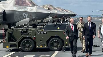 Australia and the UK have signed a 50-year pact, as the AUKUS agreement is under review in the US. Photo: Lloyd Jones/AAP PHOTOS