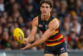 Hugh Bond will return for his first AFL game of the season in Adelaide's big clash with Hawthorn. Photo: Matt Turner/AAP PHOTOS