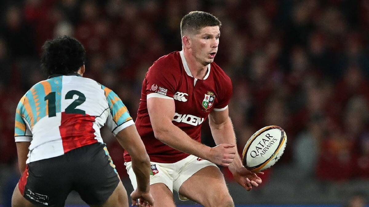 Owen Farrell offloads a pass during the Lions' midweek tour match at Marvel Stadium. (James Ross/AAP PHOTOS) Owen Farrell offloads a pass during the Lions' midweek tour match at Marvel Stadium. (James Ross/AAP PHOTOS)