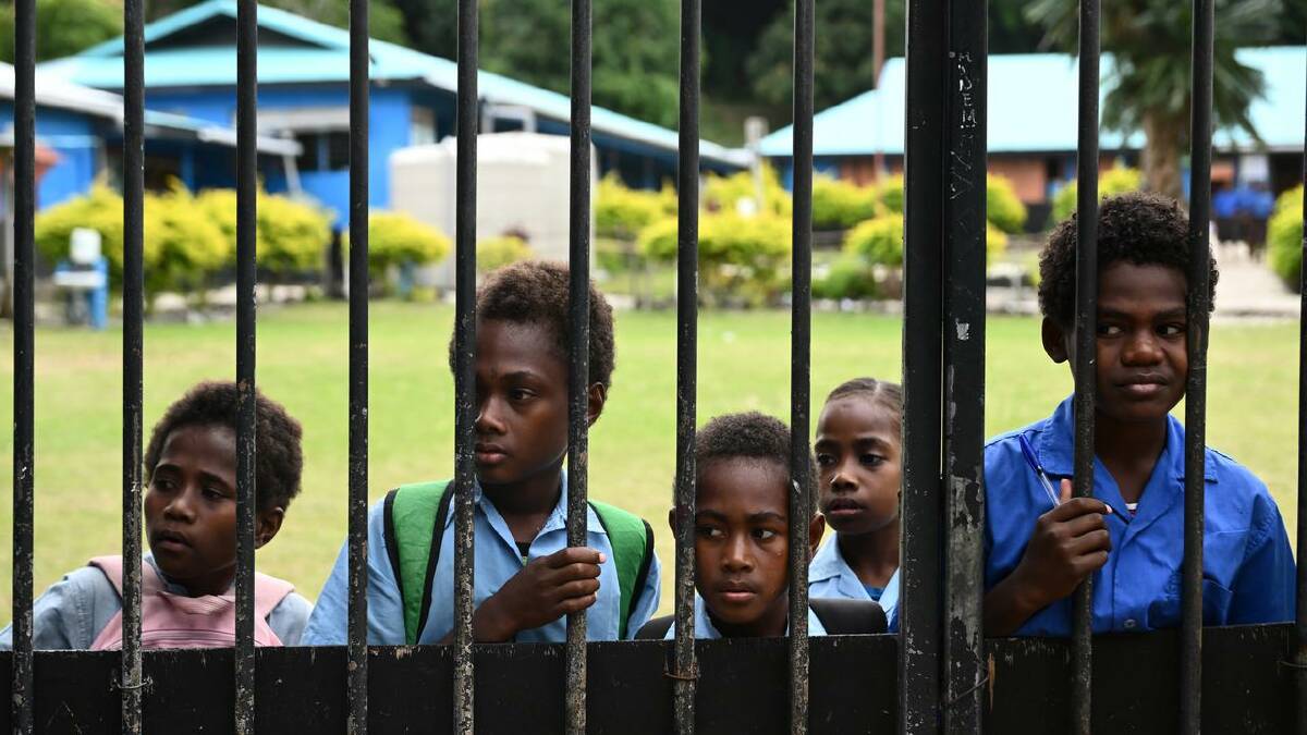 On Nguna Island, the community wants to buy extra time by protecting buildings and infrastructure. (Joel Carrett/AAP PHOTOS)