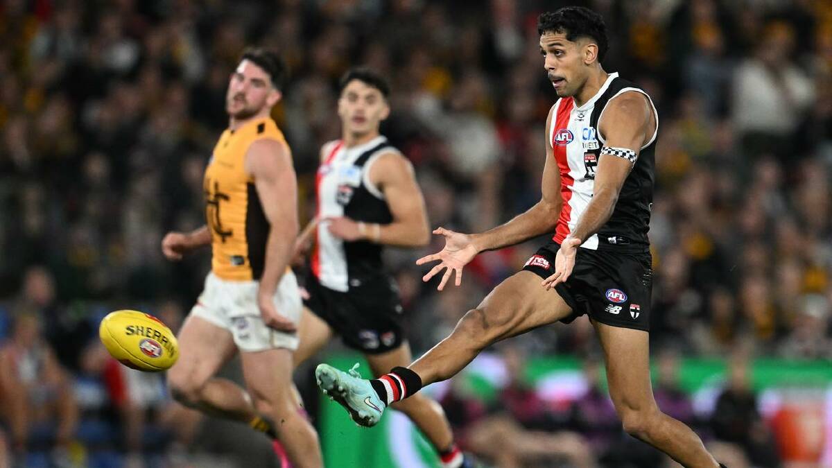 Nasiah Wanganeen-Milera gets boot to ball against the Hawks. (Joel Carrett/AAP PHOTOS)