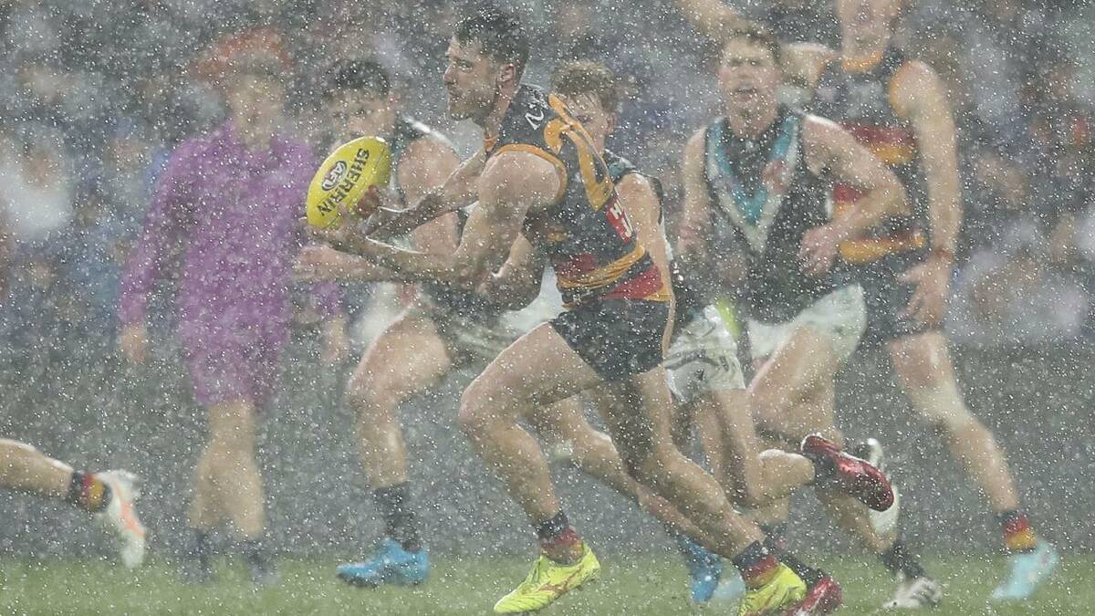 Adelaide Crows' Alex Neal-Bullen charges through the rain against Port Adelaide Power. (Matt Turner/AAP PHOTOS) Adelaide Crows' Alex Neal-Bullen charges through the rain against Port Adelaide Power. (Matt Turner/AAP PHOTOS)