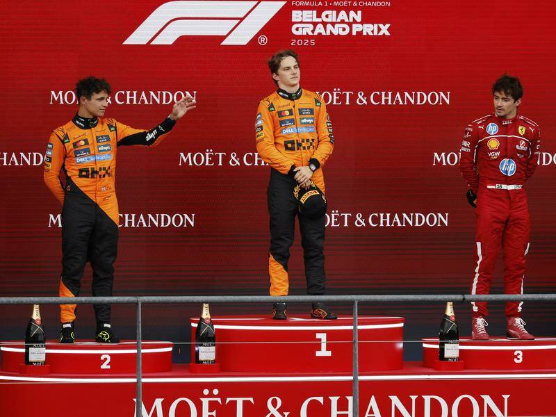 Oscar Piastri is flanked on the rostrum by Lando Norris (left) and Ferrari's Charles Leclerc. Photo: AP PHOTO Oscar Piastri is flanked on the rostrum by Lando Norris (left) and Ferrari's Charles Leclerc. Photo: AP PHOTO